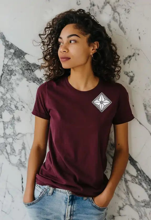 Burgundy t-shirt with a geometric diamond logo on the chest.