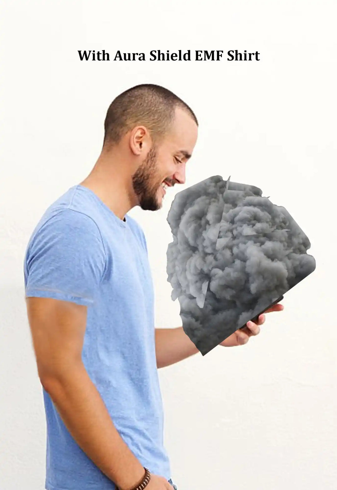 A person in a blue t-shirt looking down at a cloud-like gray mass.