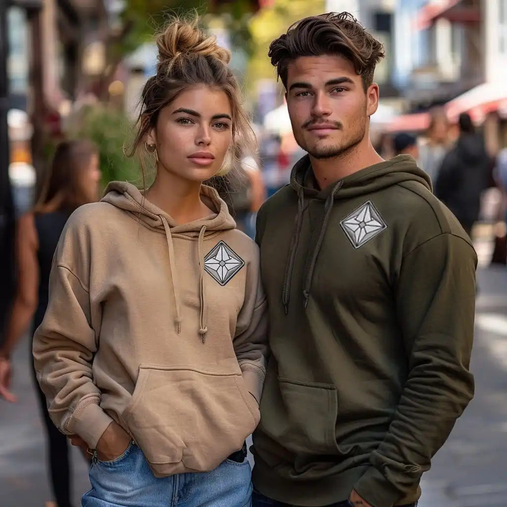 Two matching hooded sweatshirts with diamond-shaped logo patches.